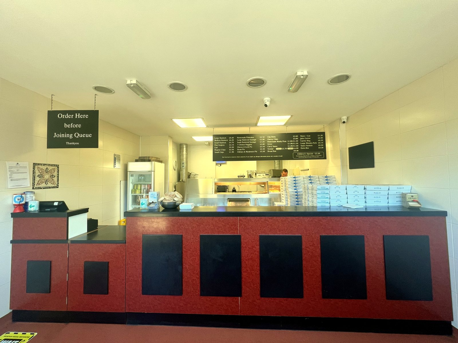 Inside the shop at the counter